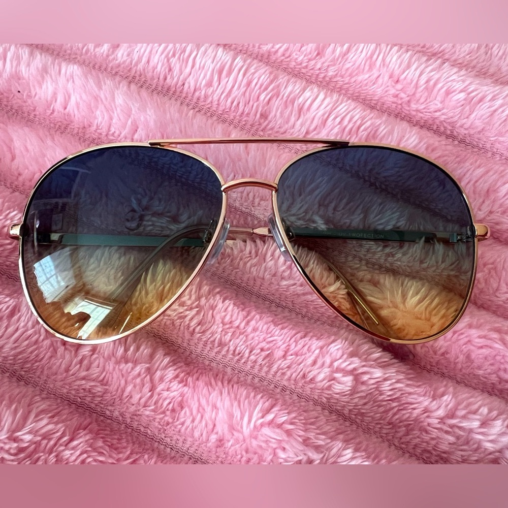 Sunglasses with ombré blue, green, and yellow lenses